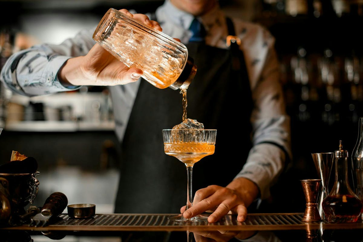 a person holding a glass of wine